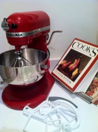 I waited years to snag a KitchenAid stand mixer and put it to use immediately! 3 of my fav's here. I love Cook's Illustrated Magazine and cookbook which is propped by my Williams-Sonoma glass cookbook holder. Both the cookbook and holder were gifts from my mom! — with Arlene Houdek.