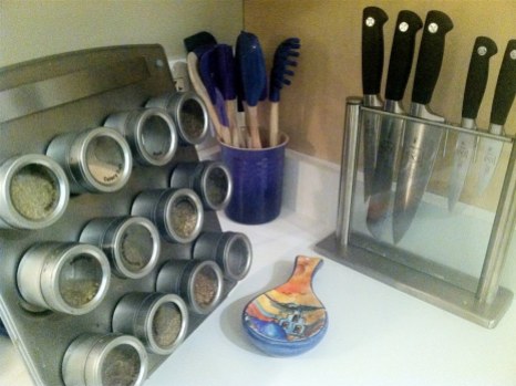 My knives Mercer Cutlery that replaced Henckels happily. Spice rack only holds a few of the essentials- there's another drawer full. Le Creuset tools are now must haves.